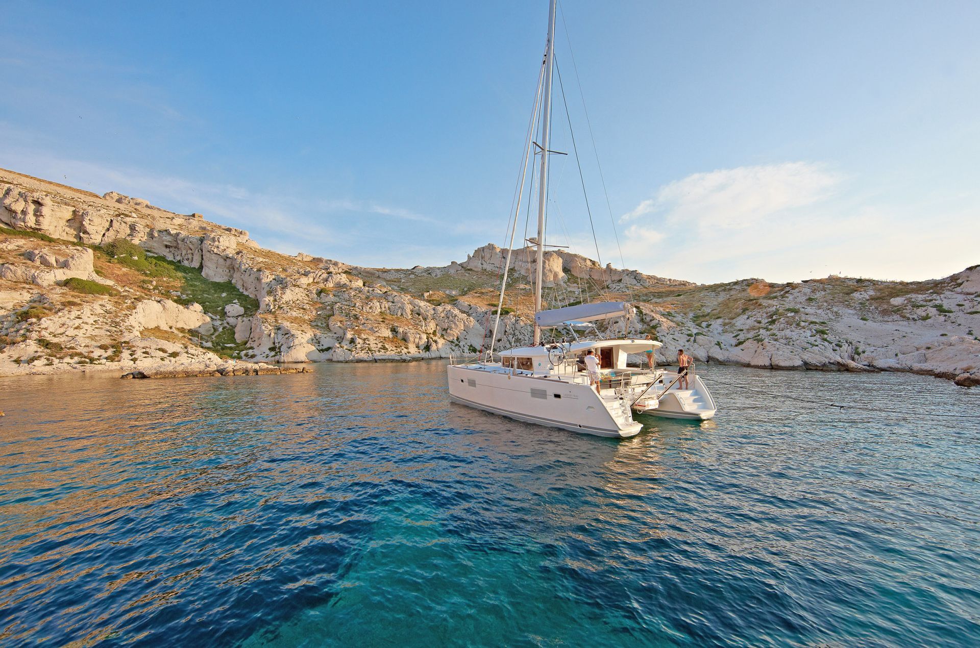 Catamaran anchored in clear blue water